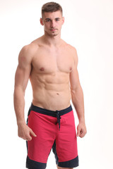 Fototapeta premium Portrait of muscle man posing in studio isolated