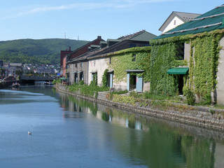 Naklejka premium The Old Warehouse along Otaru Canal, Famous Landmark of Otaru, Hokkaido, Japan 