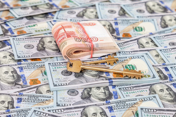 House keys and stack of five thousandths banknotes of russian ro