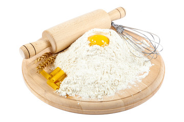 Kitchenware, flour and egg on white background.