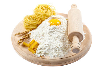 Kitchenware, flour and egg on white background.