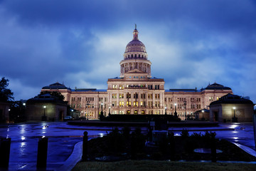 Texas State Capitol building in Austin on a rainy evening