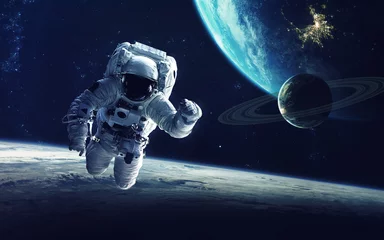 Peel and stick wall murals Picture of the day Astronaut at spacewalk. Cosmic art, science fiction wallpaper. Beauty of deep space. Billions of galaxies in the universe. Elements of this image furnished by NASA