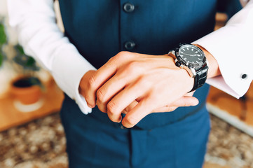watch dressed in the man's hand