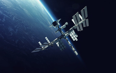 Obraz na płótnie Canvas International Space Station over the planet Earth. Elements of this image furnished by NASA