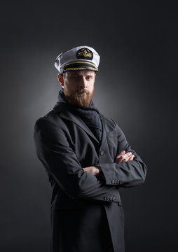 Portrait of a handsome sailor on a dark background