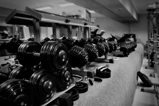 Fototapeta Modern equipment in gym. Black and white photo