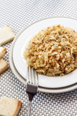 Fried cabbage with caraway and garlic on a plate