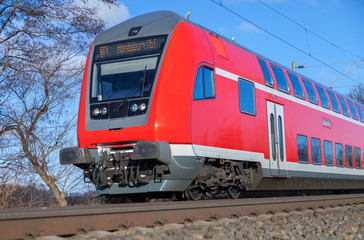 german passenger train drives to the next station