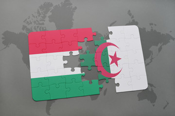 puzzle with the national flag of hungary and algeria on a world map
