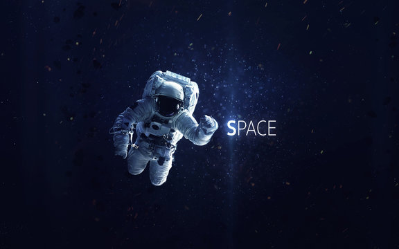 Astronaut at spacewalk. Cosmic art, science fiction wallpaper. Beauty of deep space. Billions of galaxies in the universe. Elements of this image furnished by NASA © Vadimsadovski