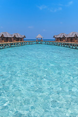 Beautiful tropical Maldives resort hotel with beach and blue water for relax. 