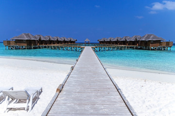Fototapeta na wymiar Beautiful tropical Maldives resort hotel with beach and blue water for relax.