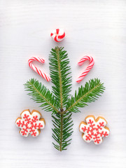Christmas background with gingerbread cookies  and green fir tre