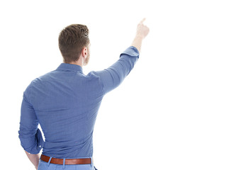 Back view of pointing business man pointing to the top.