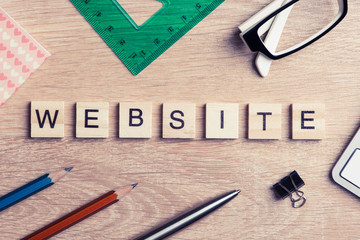 Computer and internet conceptual words spelled with game wooden 