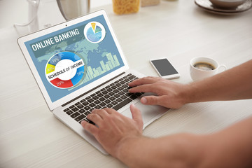 Online banking concept. Man using laptop