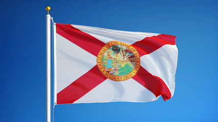 Naklejka premium Florida (U.S. state) flag waving against clear blue sky, close up, isolated with clipping path mask alpha channel transparency, perfect for film, news, composition