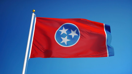 Tennessee (U.S. state) flag waving against clear blue sky, close up, isolated with clipping path...