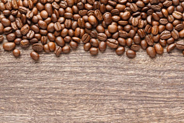 Coffee beans on wooden background