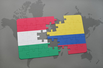 puzzle with the national flag of hungary and colombia on a world map