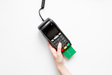 payment terminal with card on white background top view