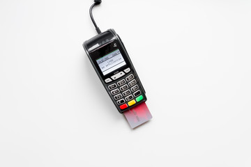 payment terminal with card on white background top view