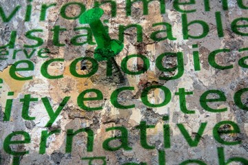 Push pin on ecology word cloud grunge concept
