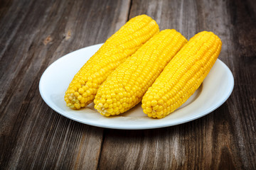 Corn on the background of the wooden planks