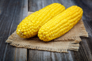 Corn on the background of the wooden planks