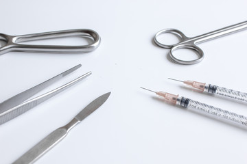 instruments for plastic surgery on white background