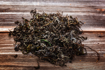 Fototapeta na wymiar Herbal tea on background of wooden planks