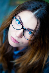 Beautiful girl with glasses. Woman with blue eyes with glasses.