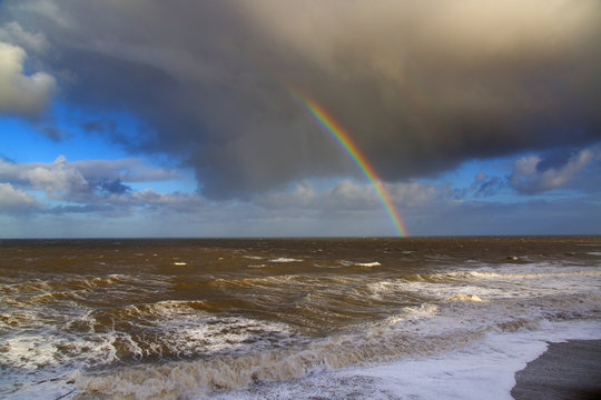Rainbow off Weybourne Norfolk in rain storm