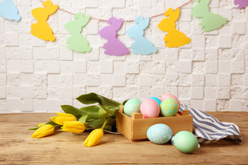 Easter eggs and decorations on table