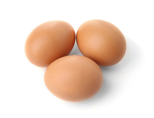 Raw eggs on white background