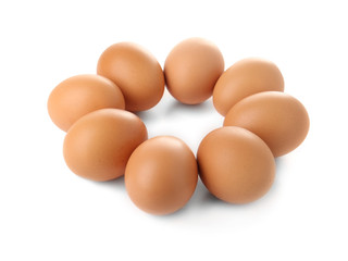 Raw eggs on white background