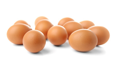Raw eggs on white background