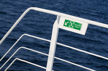 ferry sign for passengers indicating where to congregate in emergency - 132379325