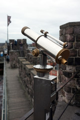 Fototapeta na wymiar Telescope on top of a castle to view the city