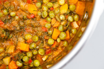 Stew with peas, carrots, onions, tomato sauce and spices
