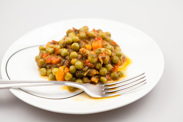 Stew with peas, carrots, onions, tomato sauce and spices
