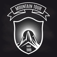 Travel label design vector illustration. Mountain tour retro badge on blackboard