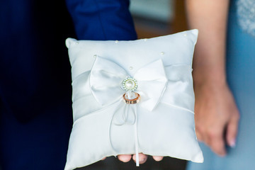 Wedding rings on the lace pillow