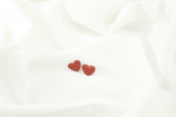 Love Valentines Day red heart on off white linen fabric backgrou