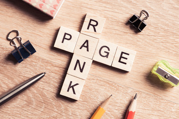 Conceptual media keywords on table with elements of game making crossword