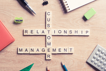 Conceptual business keywords on table with elements of game making crossword