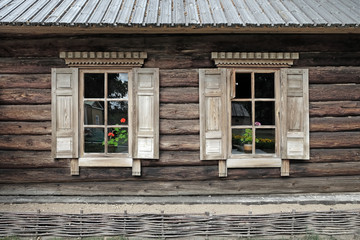 Fototapeta na wymiar Facade of wooden folk house in the Russia
