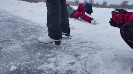 People skate on the skating sports rink in the winter on ice, a active winter holiday family