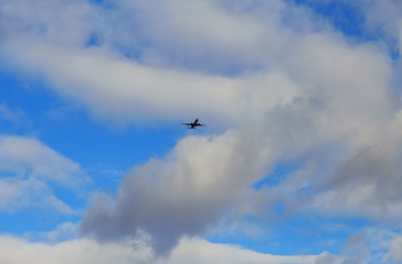 airplane flying through dark stormy clouds